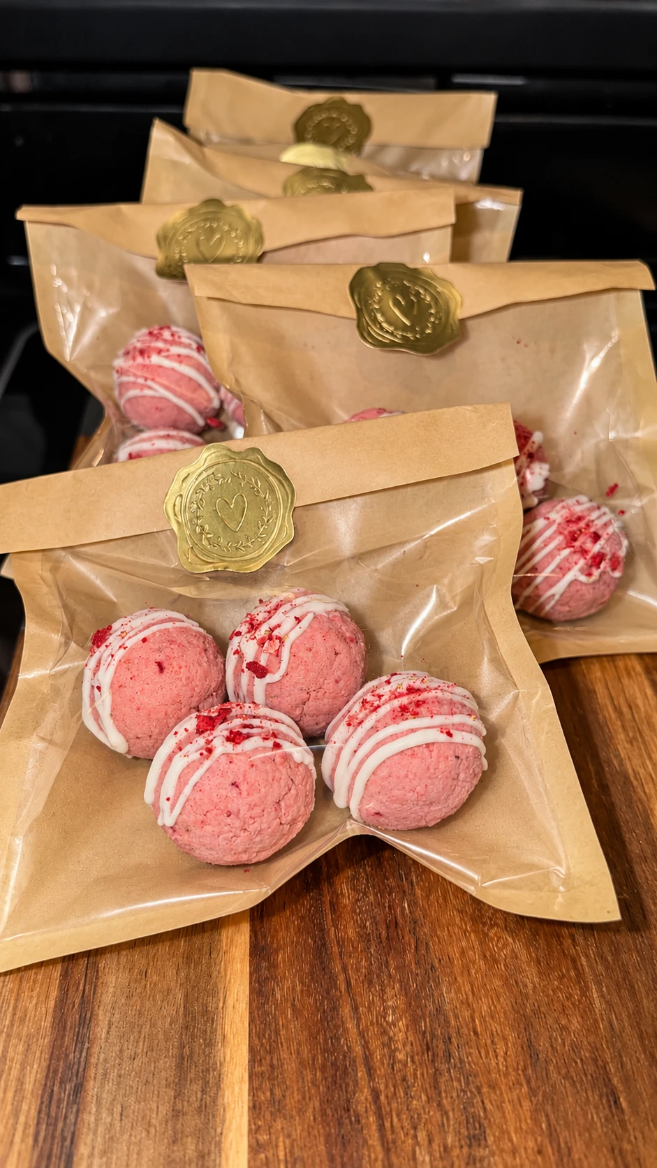 MIMBOLO protein bites packed in kraft bags with gold seals