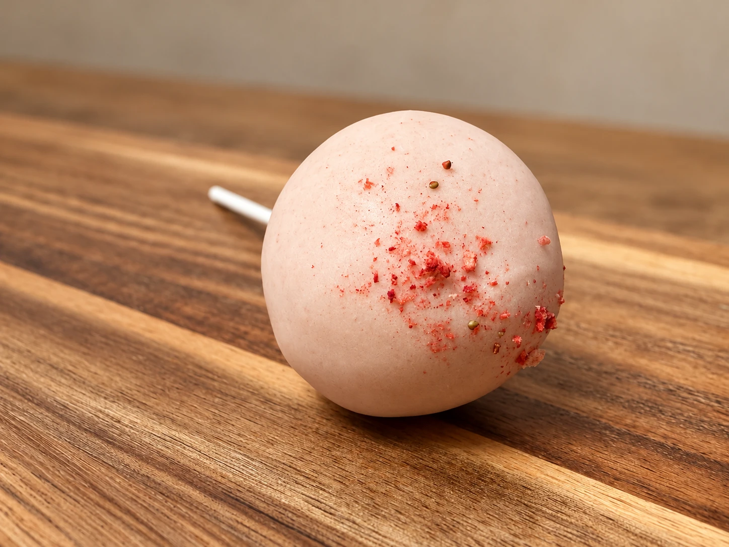 A MIMBOLO protein pop on a walnut board